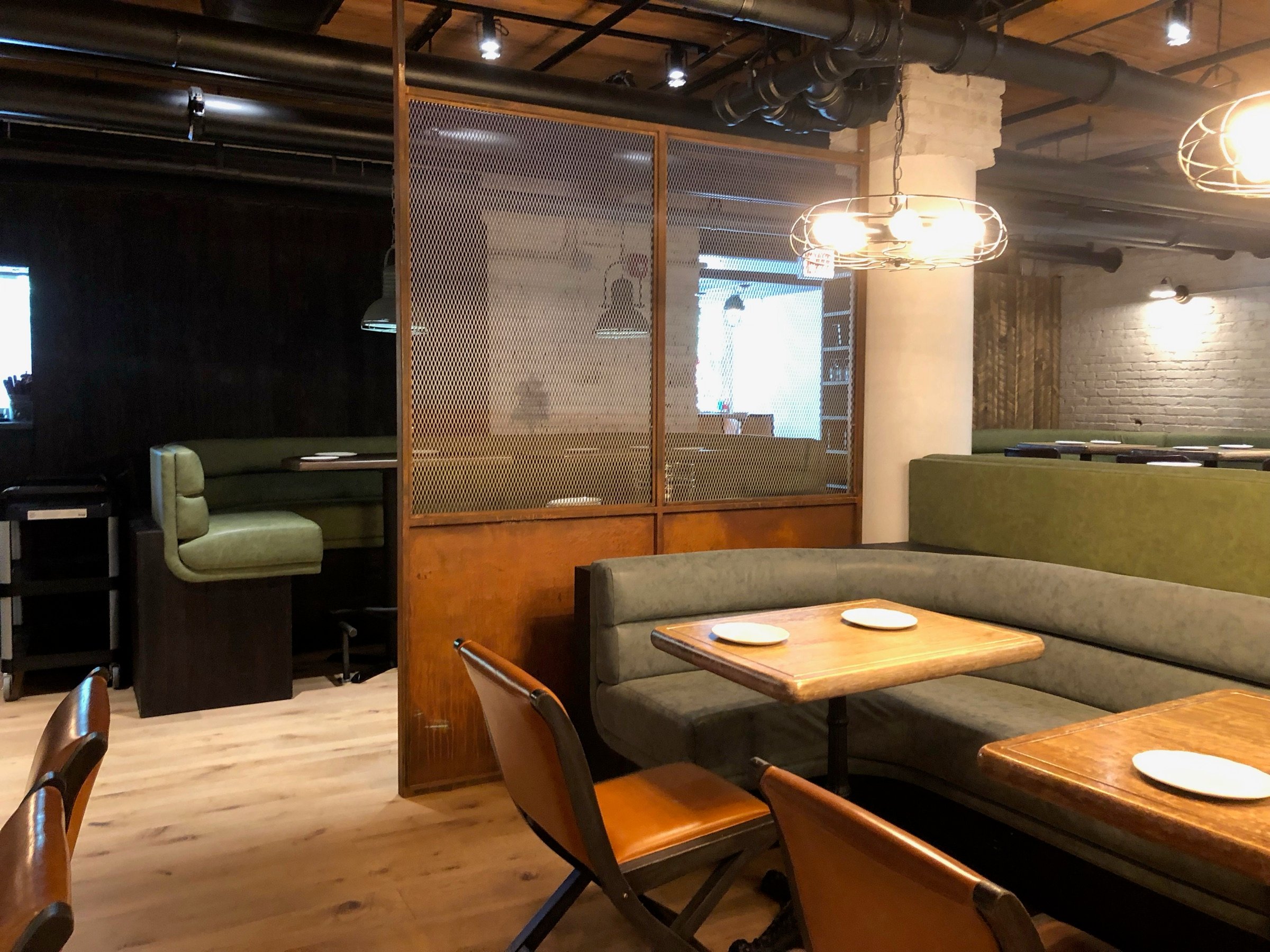 Banquette seating and custom partition detail at Roberts Pizza