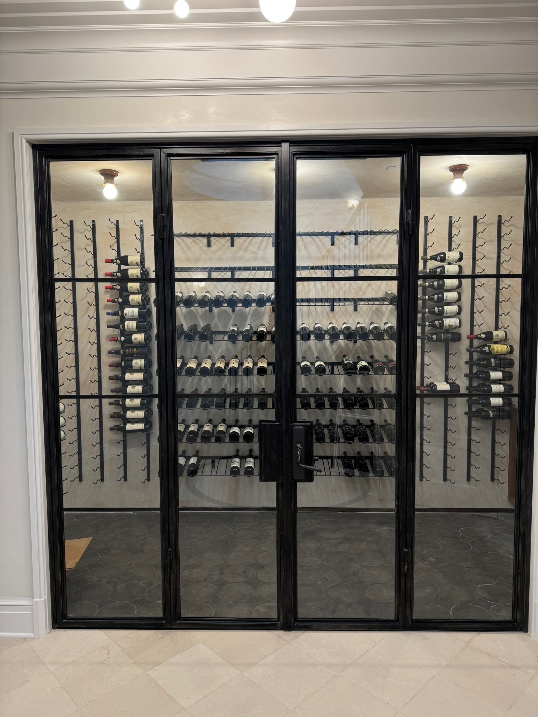 Close-up of the arched top and glazing on the wine cellar doors